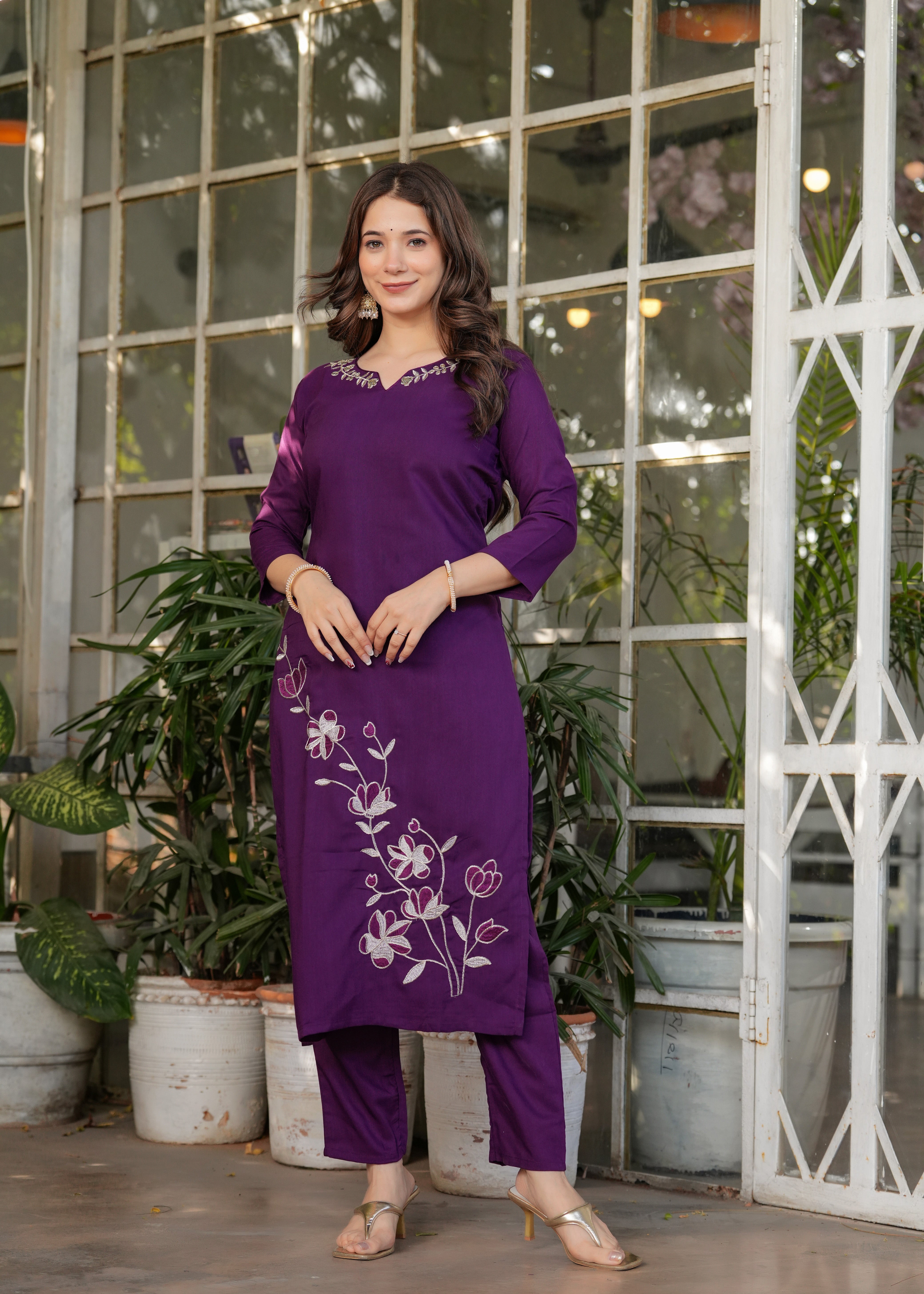 Woman in a purple outfit .