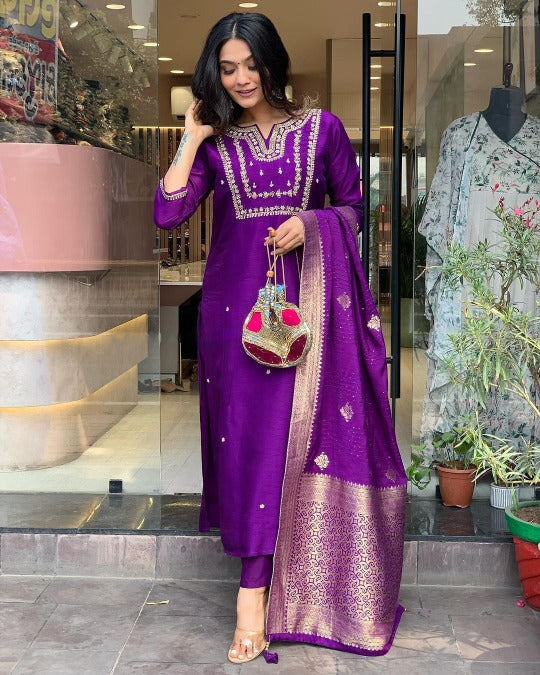 Woman in a purple traditional outfit .