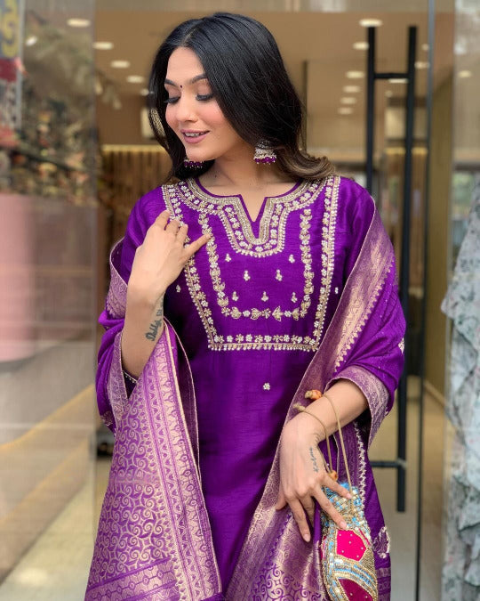 Woman in a purple traditional outfit .