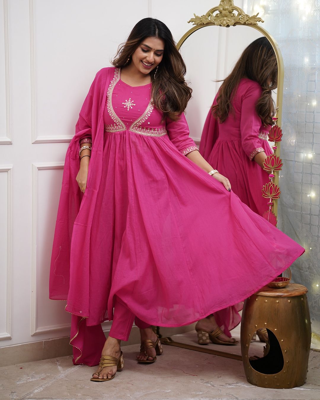 Woman in a bright pink traditional outfit