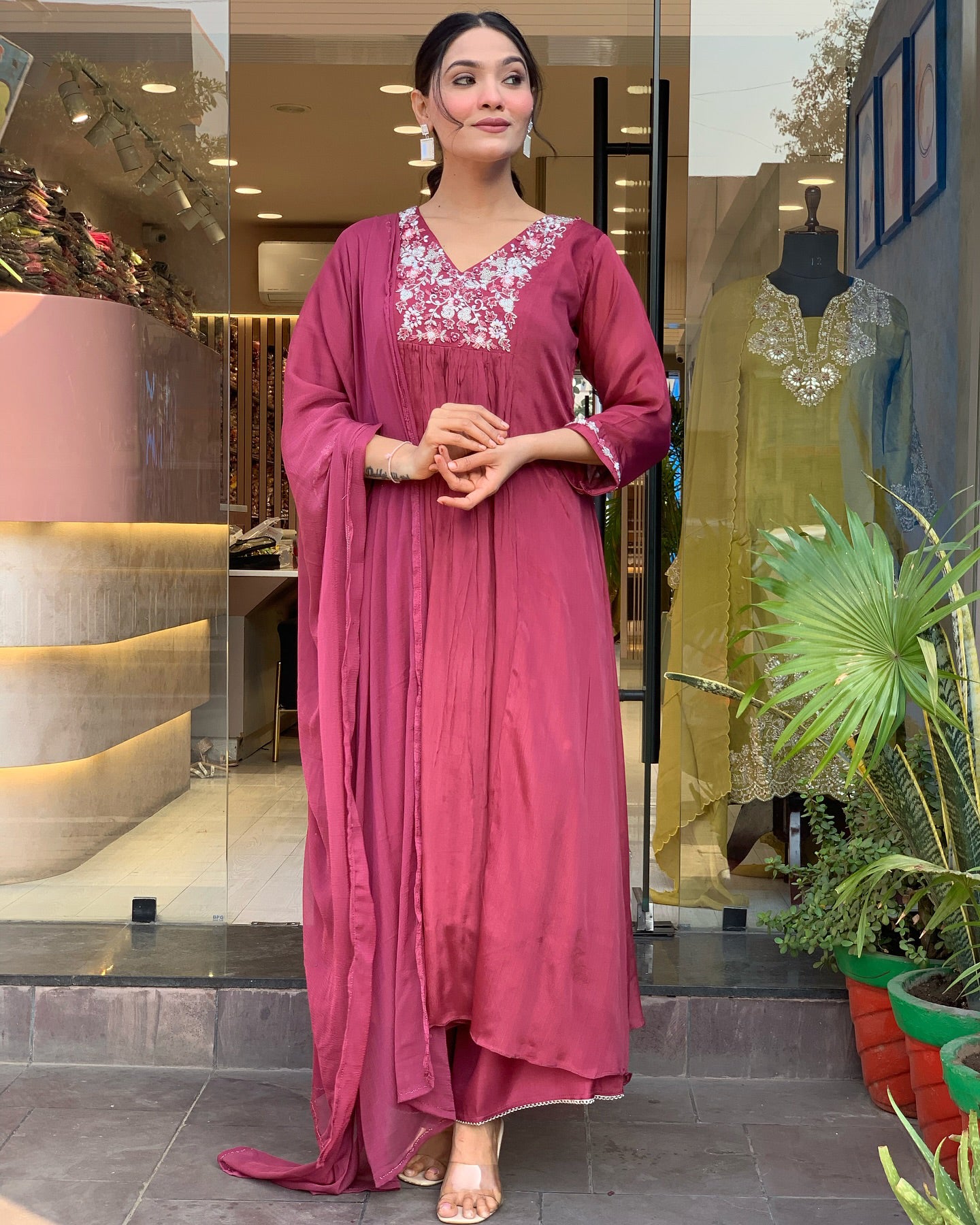 Woman in a pink traditional outfit .