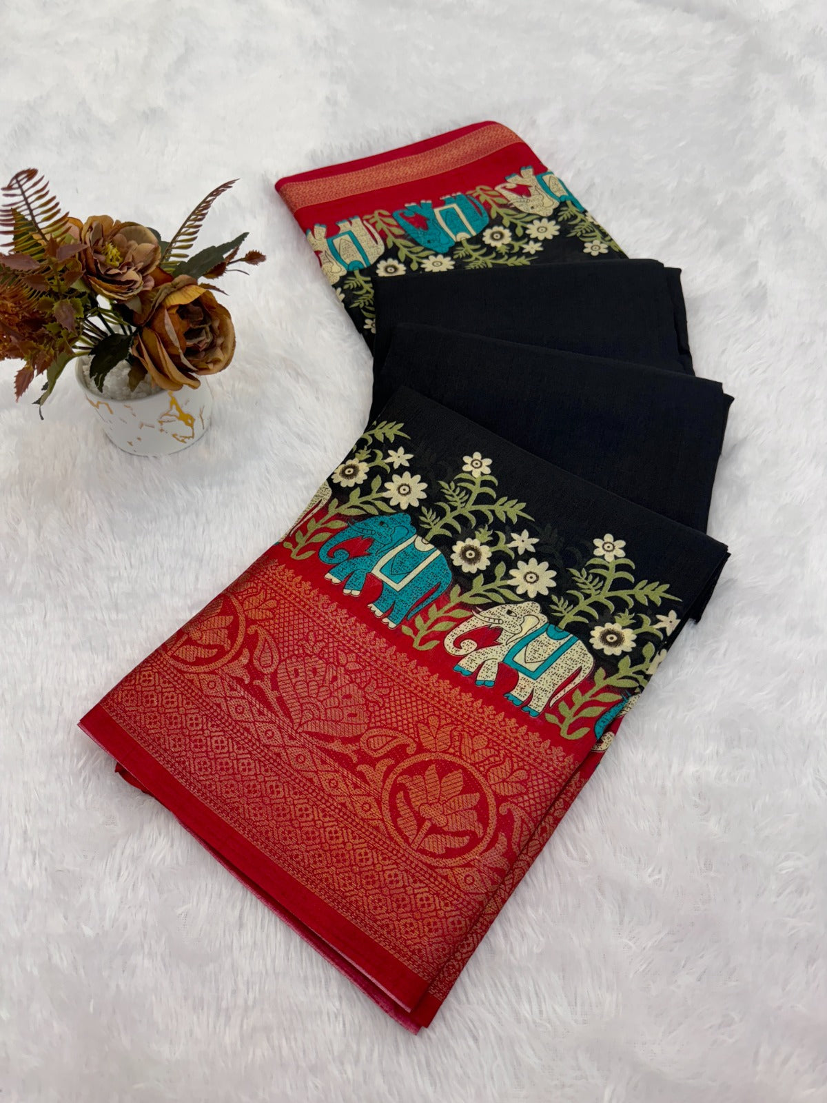 ethnic wardrobe with this exquisite pair of traditional patterned sarees