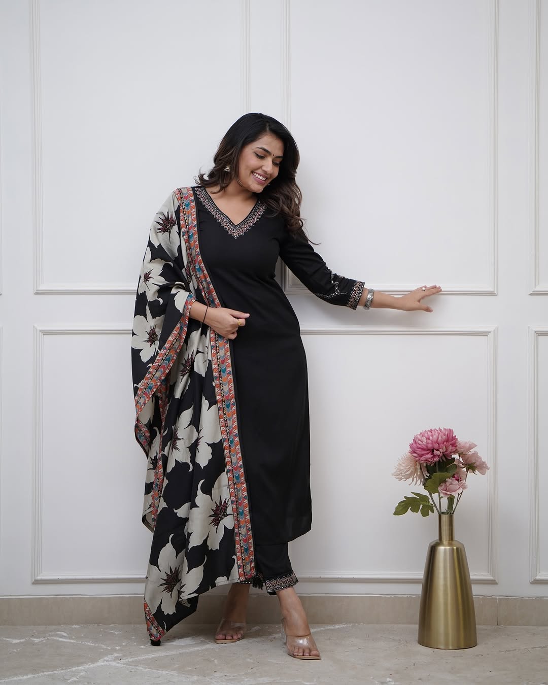 Elegant black suits adorned with intricate embroidery work