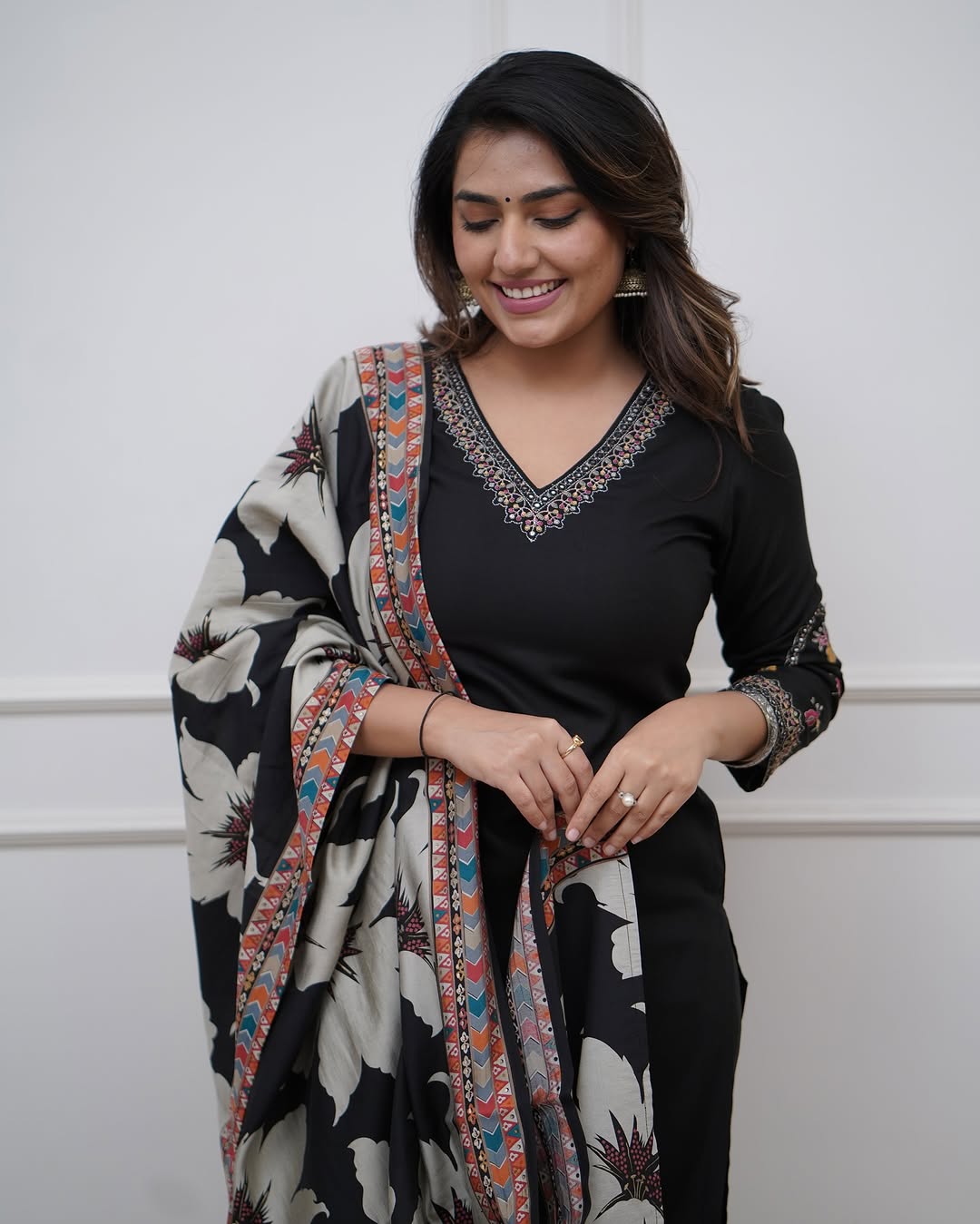 Elegant black suits adorned with intricate embroidery work