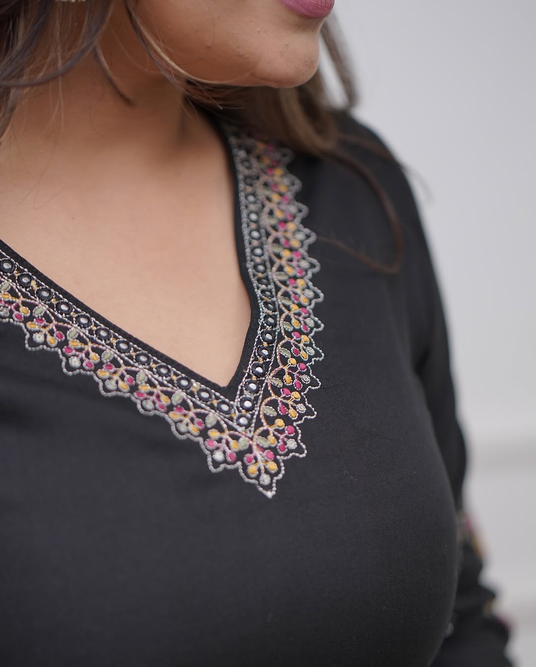 Elegant black suits adorned with intricate embroidery work