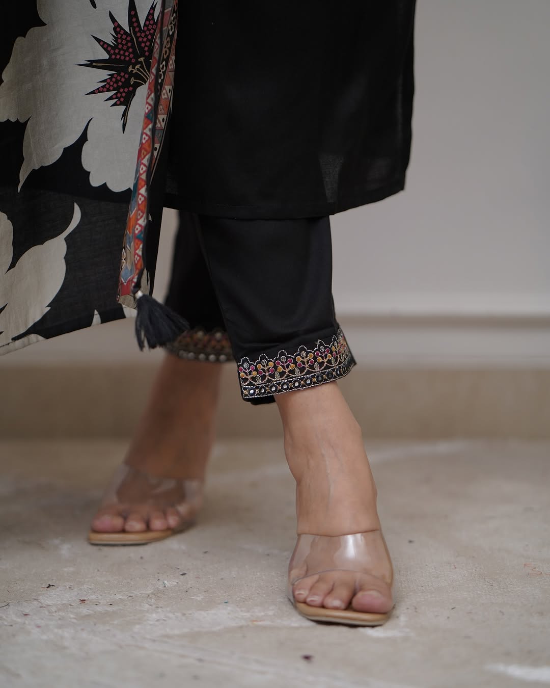 Elegant black suits adorned with intricate embroidery work