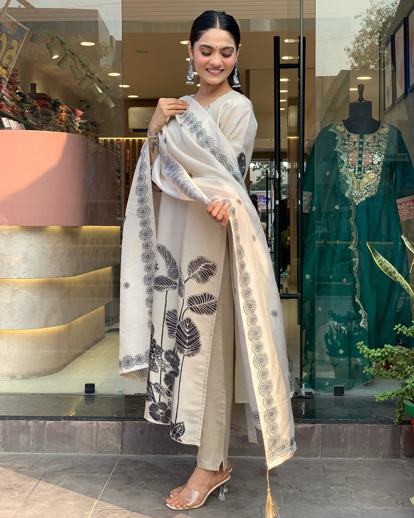 Woman in a floral black n white embroidery outfit