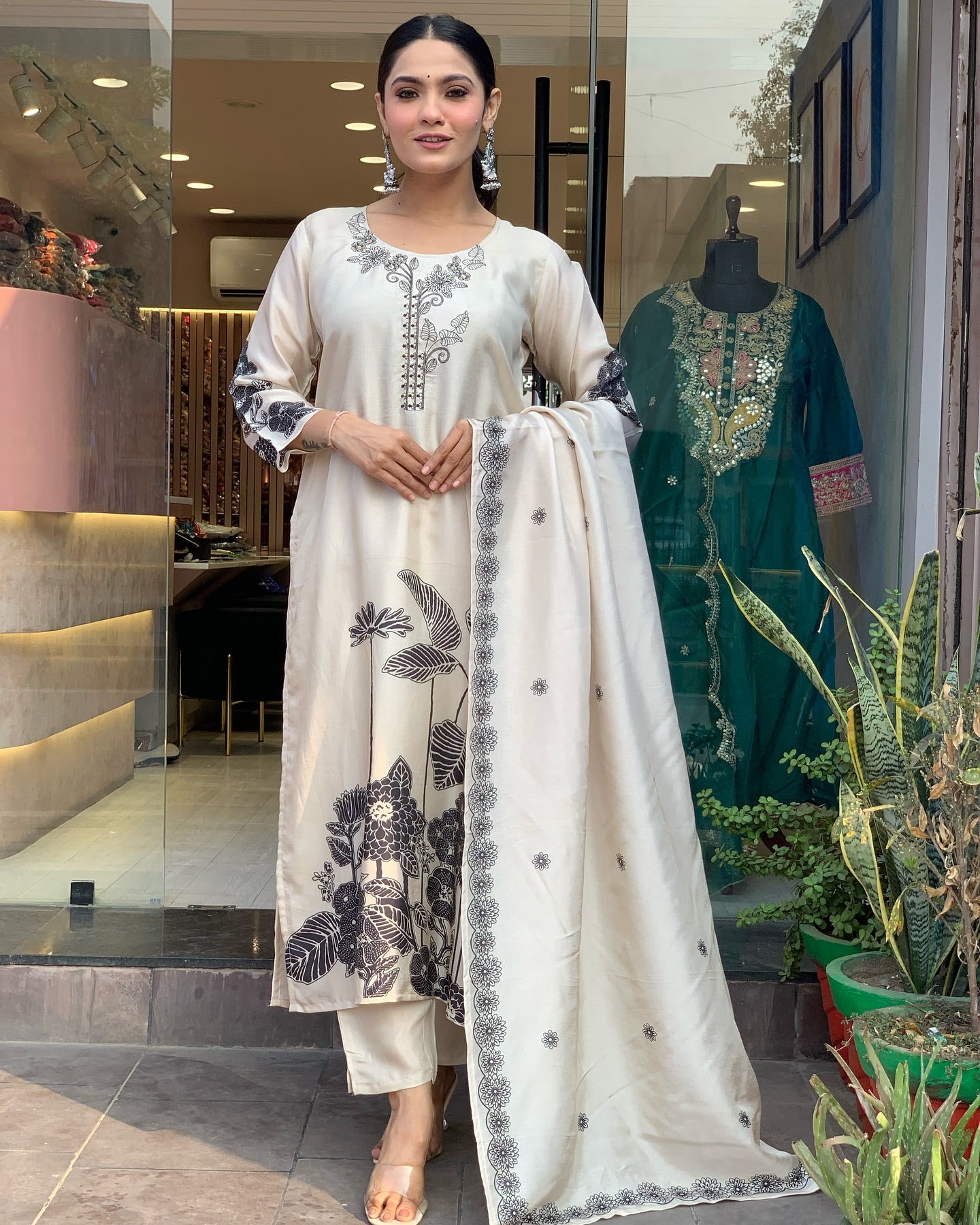 Woman in a floral black n white embroidery outfit