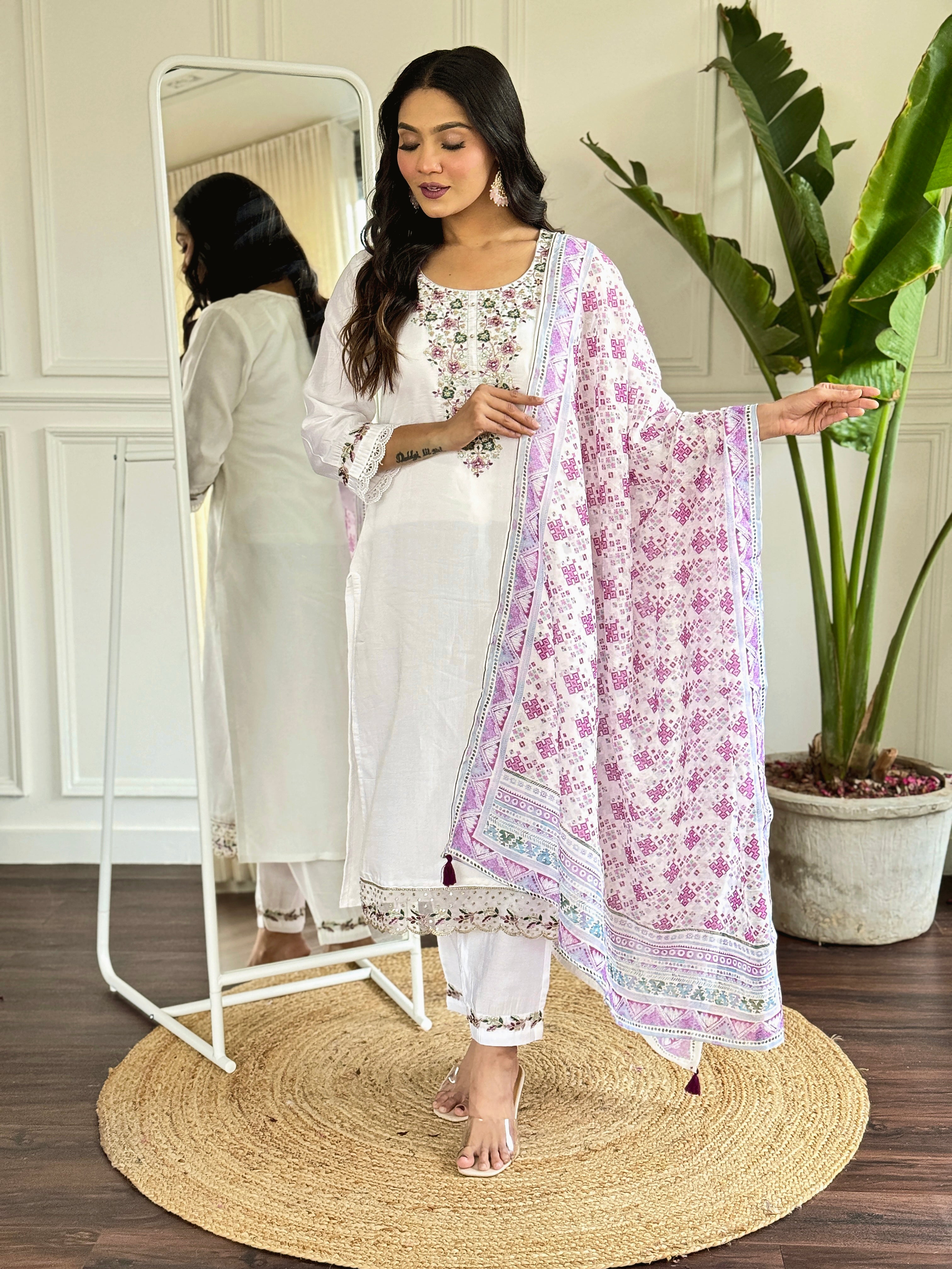 legant white salwar suit crafted from luxurious Viscose Chanderi fabric.