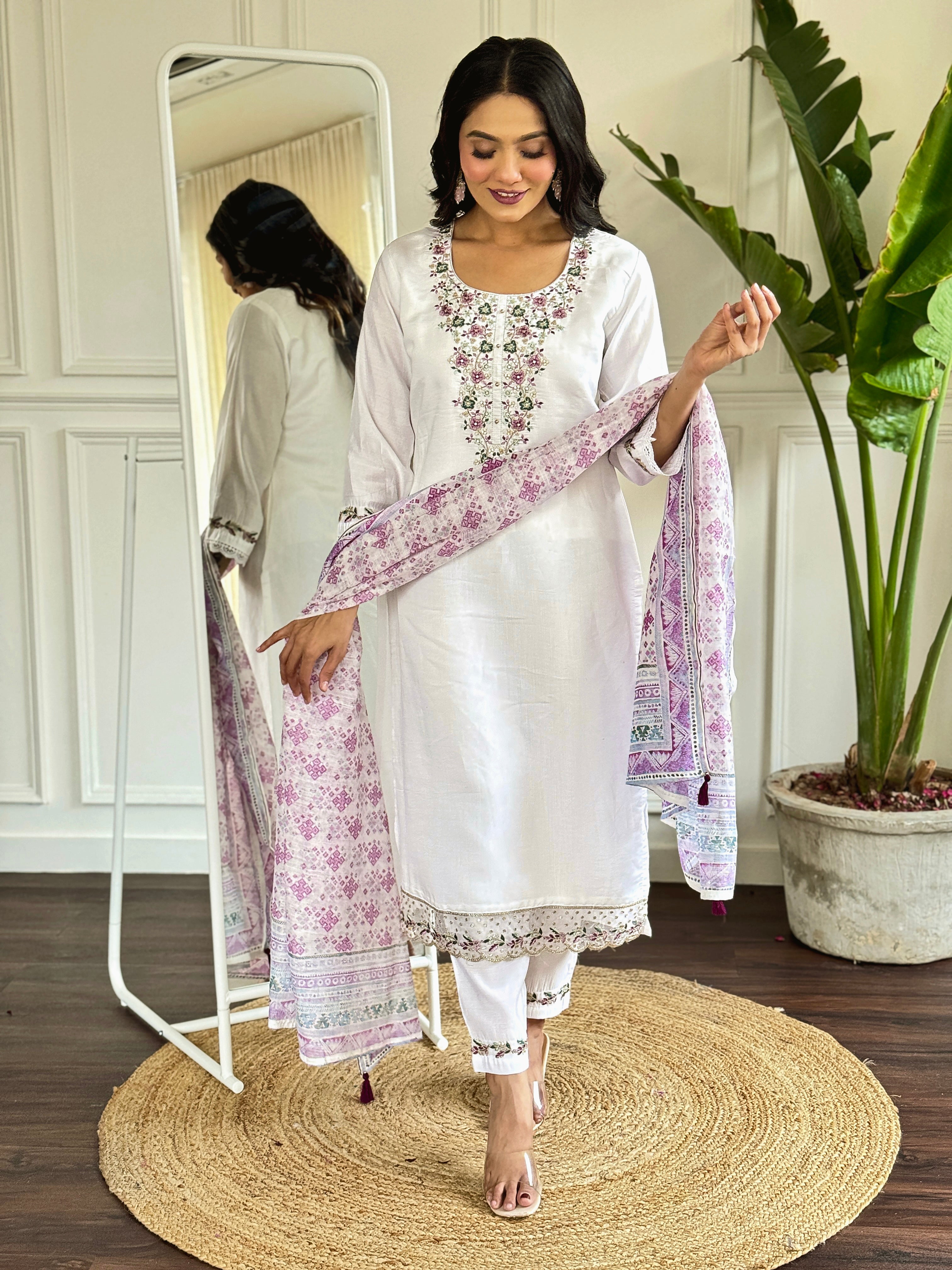 legant white salwar suit crafted from luxurious Viscose Chanderi fabric.