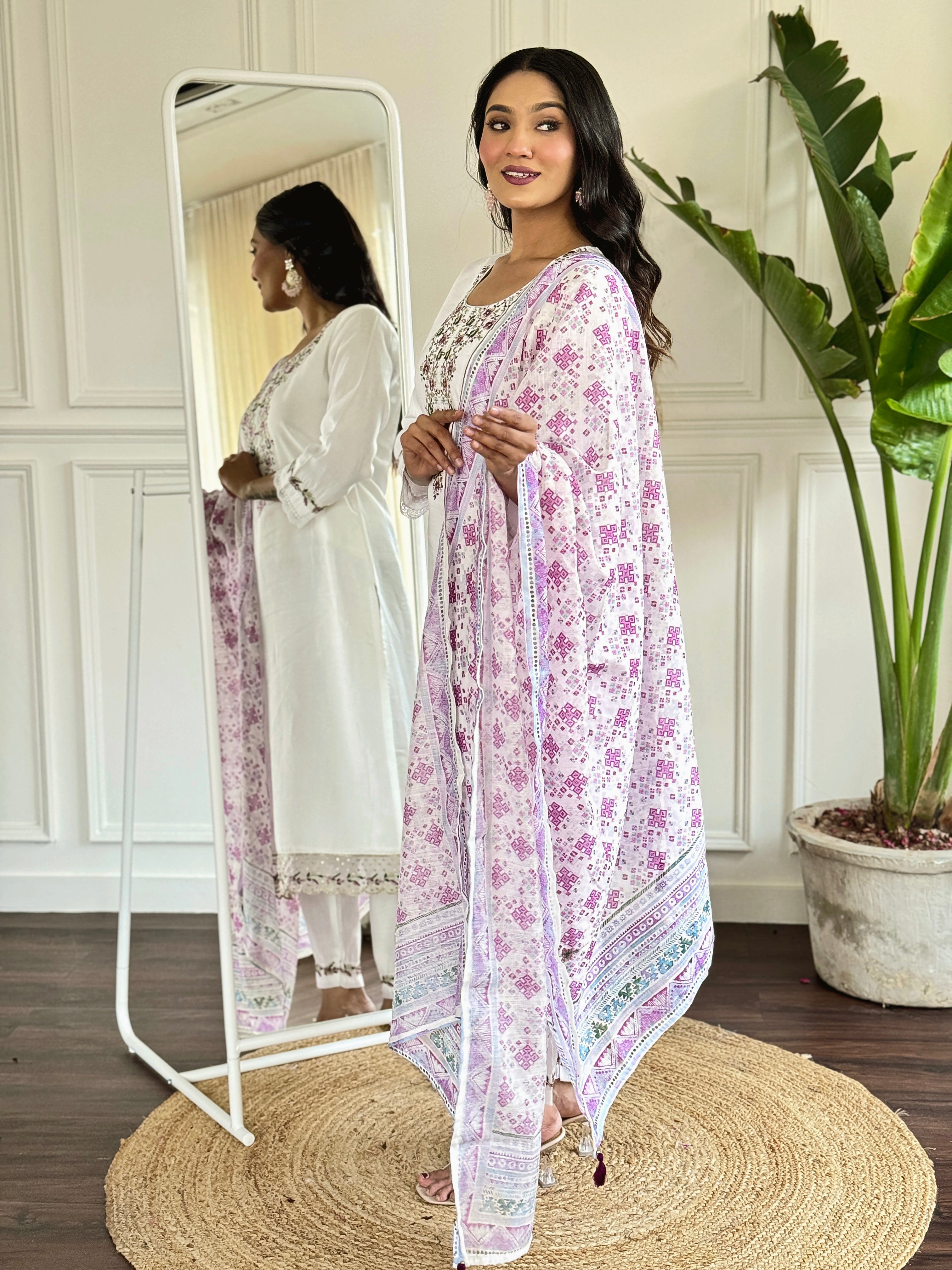 legant white salwar suit crafted from luxurious Viscose Chanderi fabric.