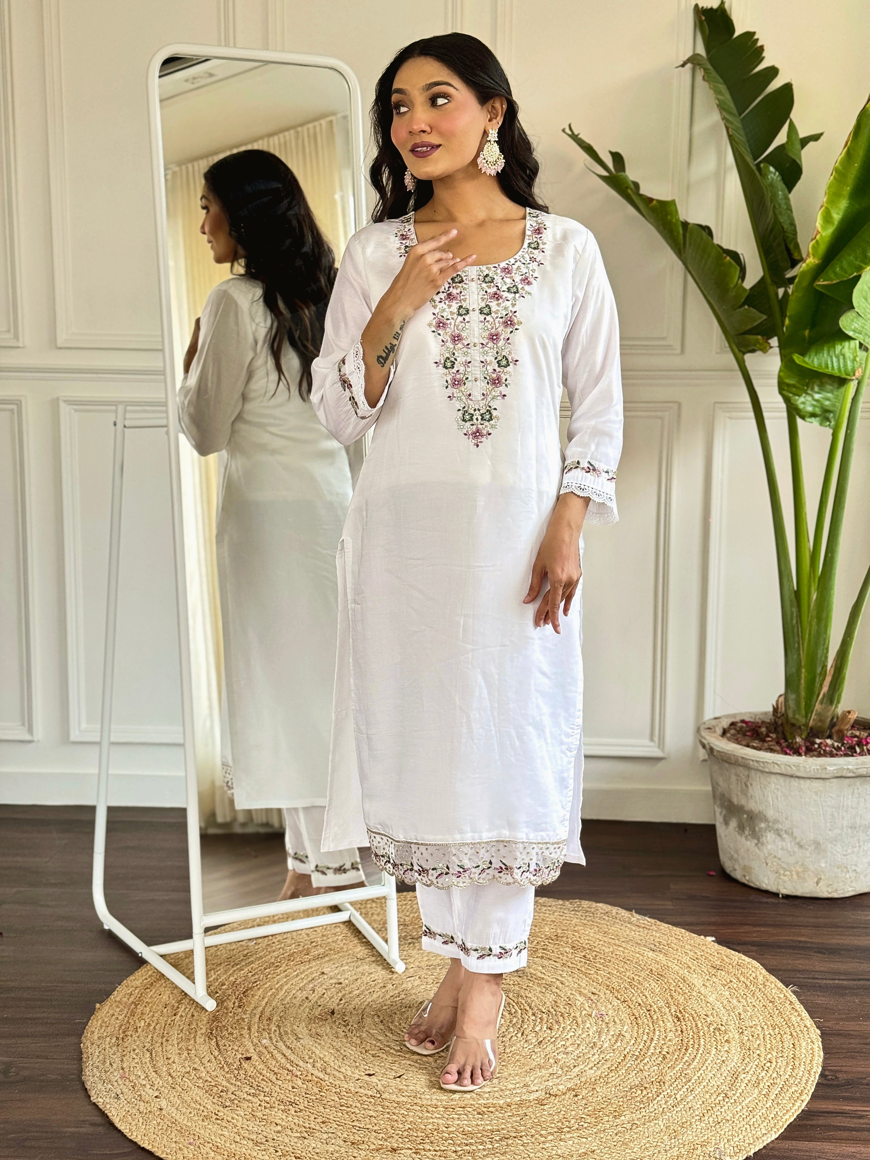 legant white salwar suit crafted from luxurious Viscose Chanderi fabric.