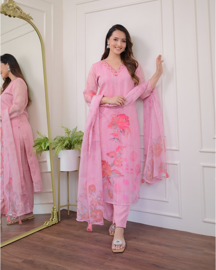 Woman in a pink floral outfit .