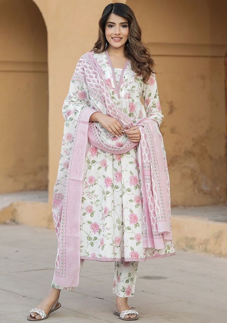 wearing a floral outfit with a pink dupatta 