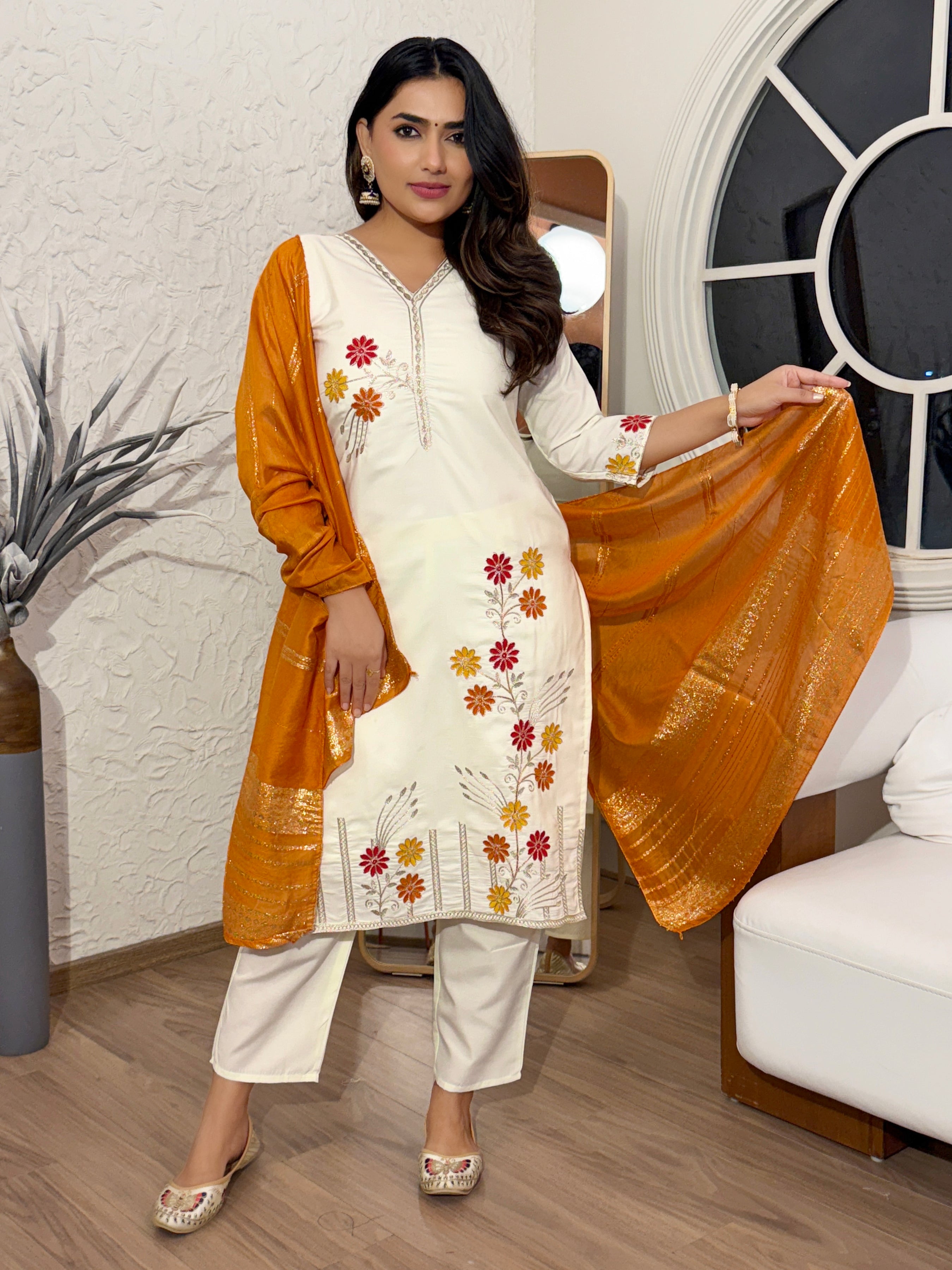 Woman in a white and orange traditional outfit