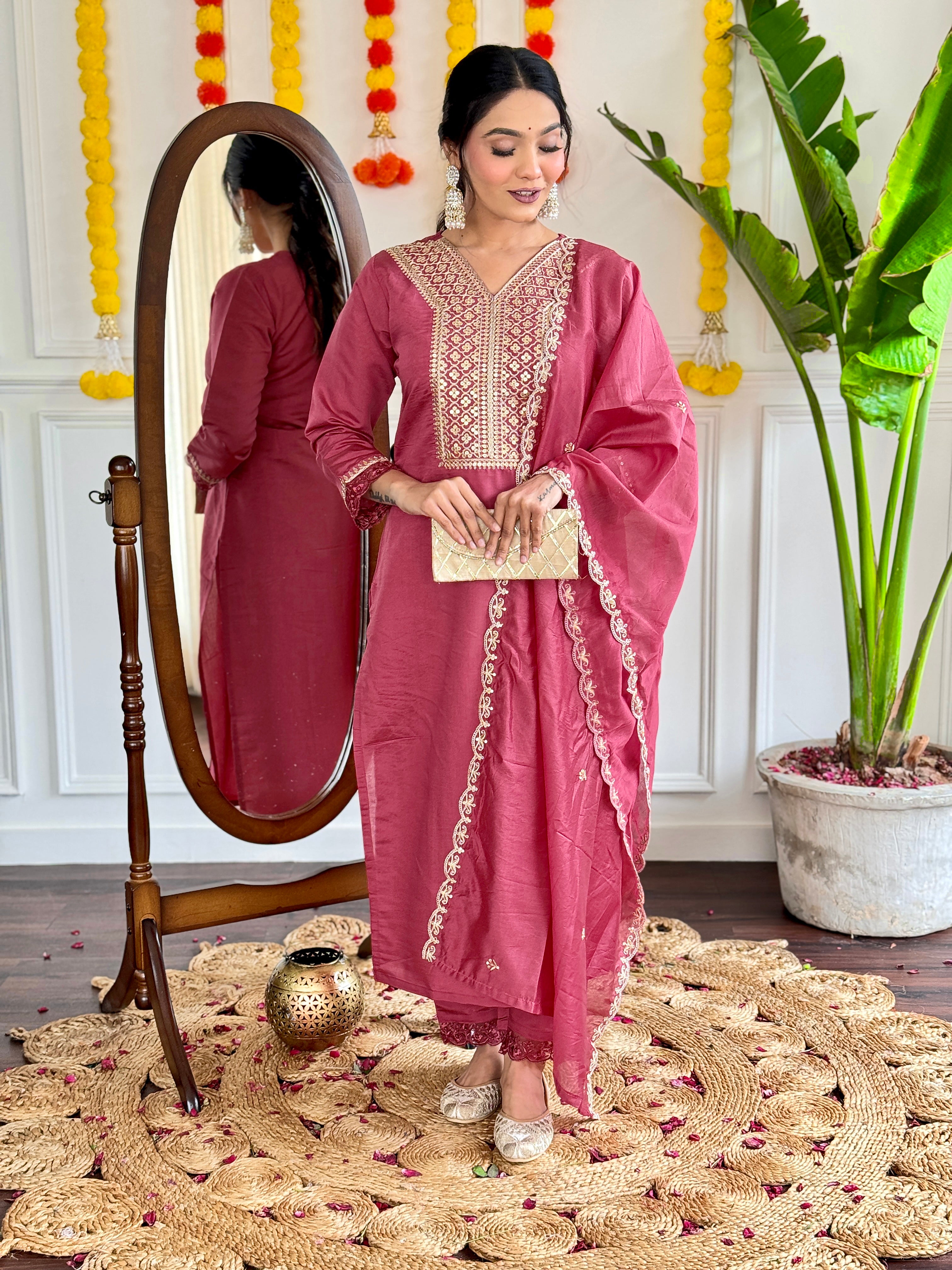 maroon traditional outfit with gold embroidery,