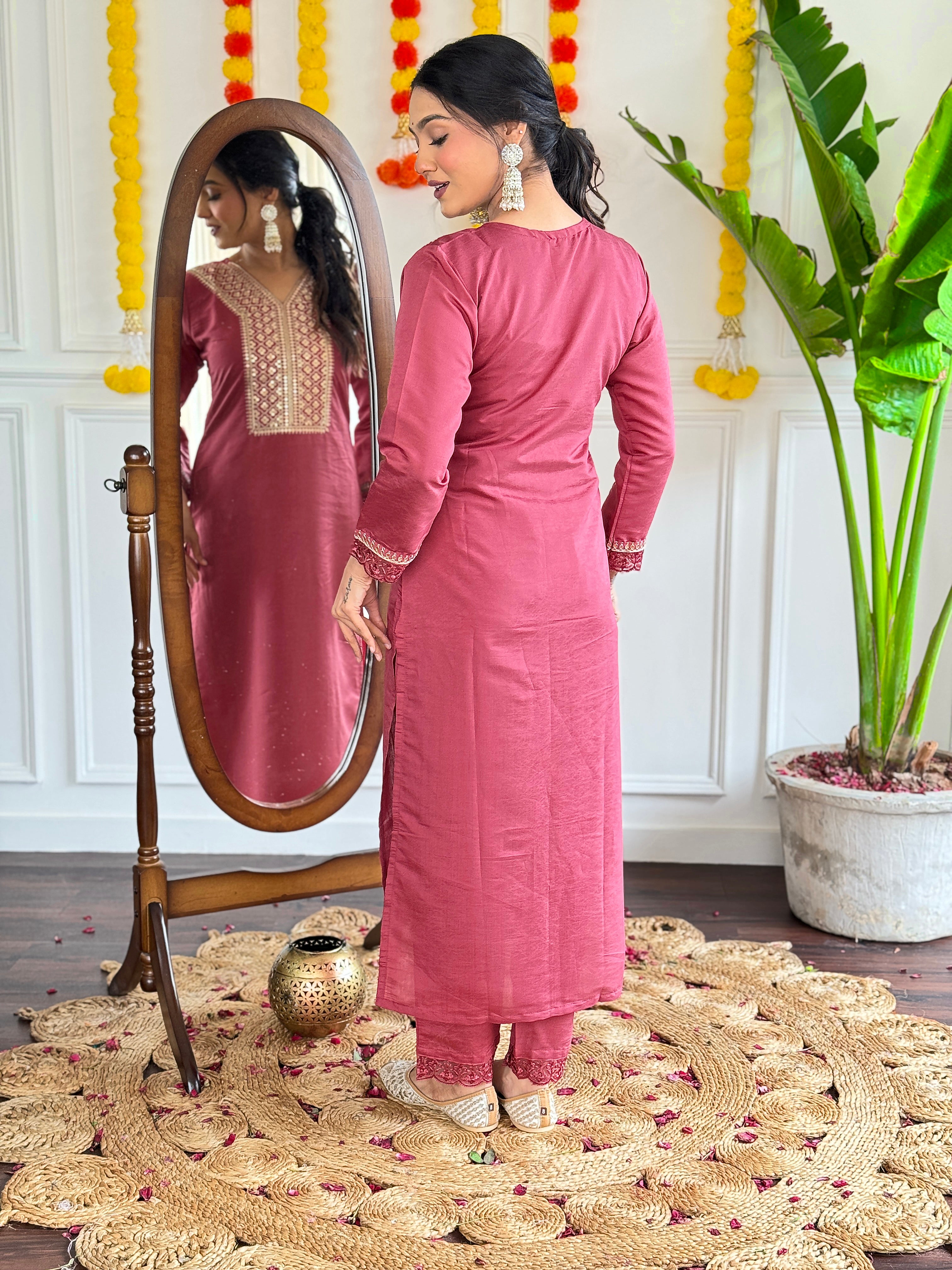 maroon traditional outfit with gold embroidery,