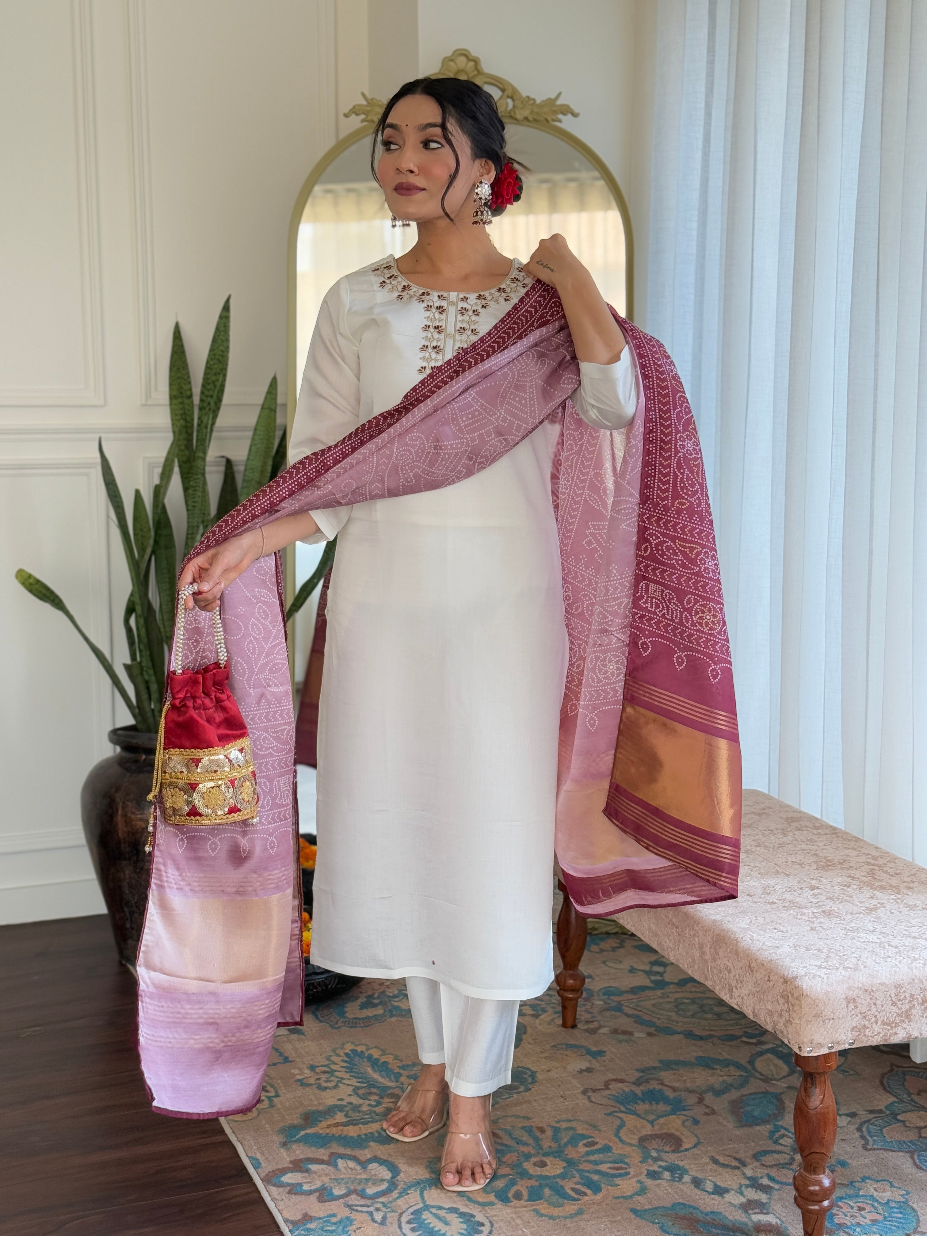 Elegant white embroidered traditional outfit paired with a rich maroon dupatta