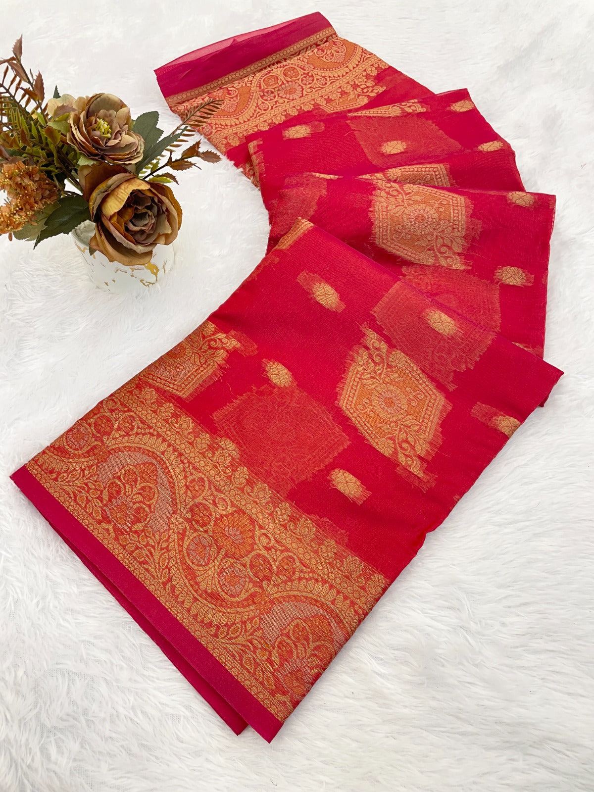 Elevate your ethnic wardrobe with this stunning organza saree
