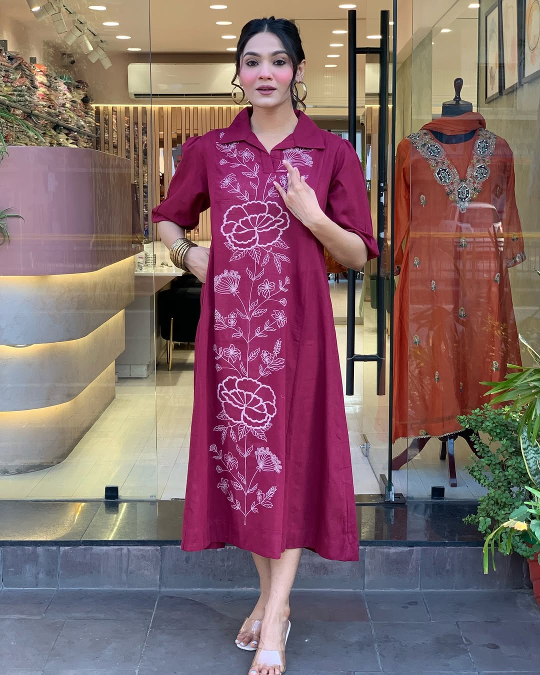 Woman wearing a berry colour kurti