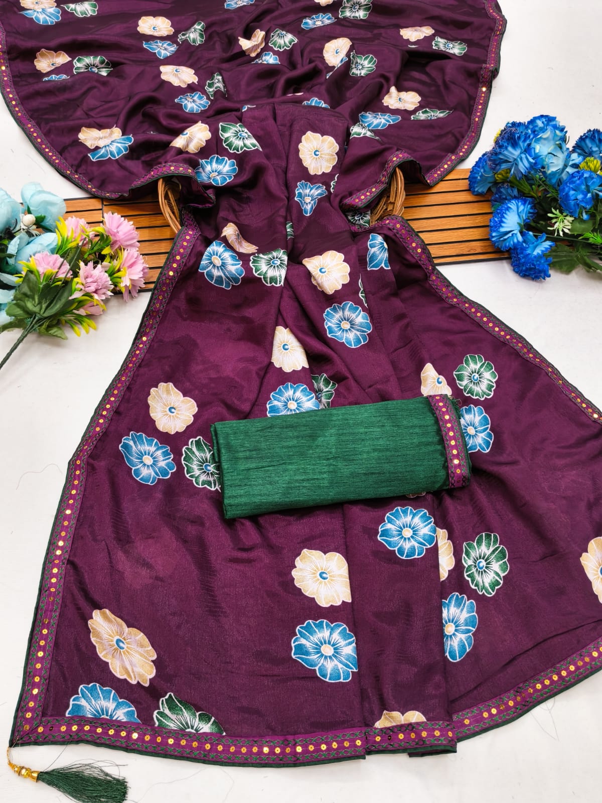 Elegant sarees with sequined borders and contrasting raw silk blouses.