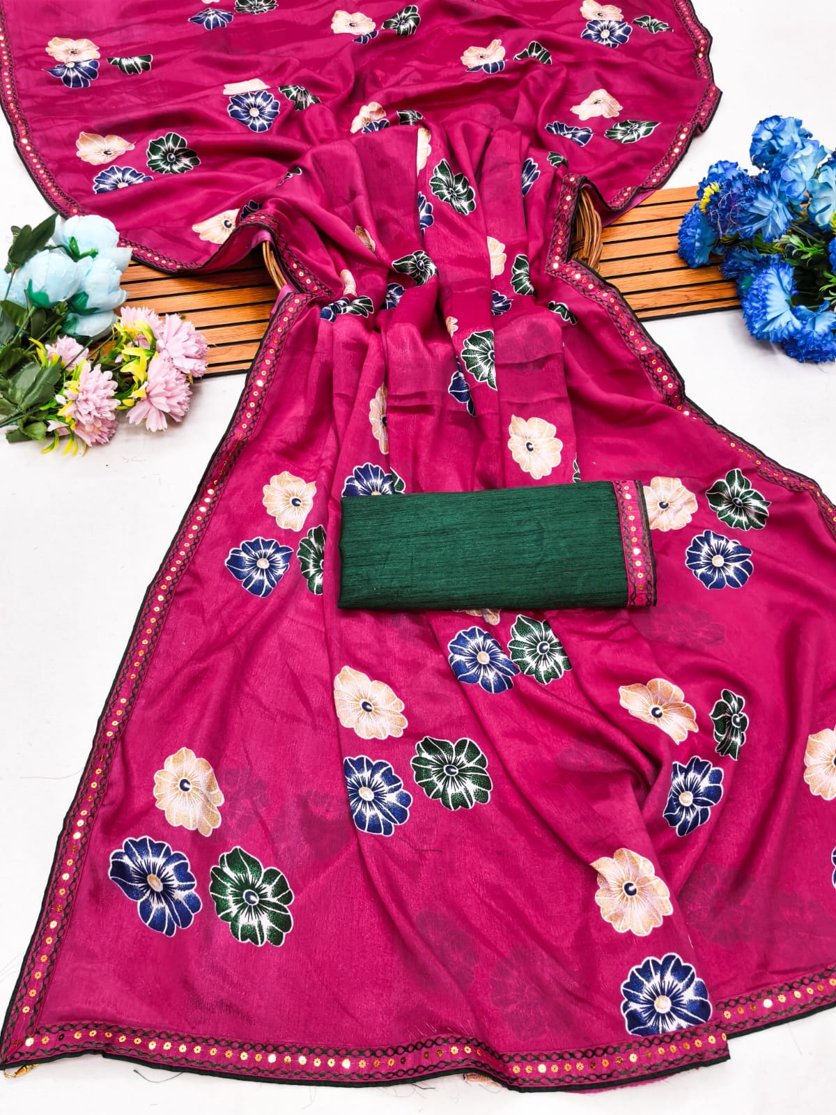 Elegant sarees with sequined borders and contrasting raw silk blouses.
