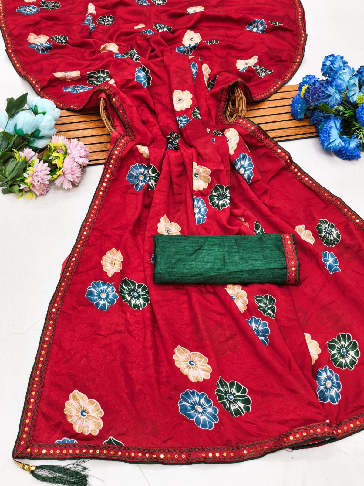 Elegant sarees with sequined borders and contrasting raw silk blouses.