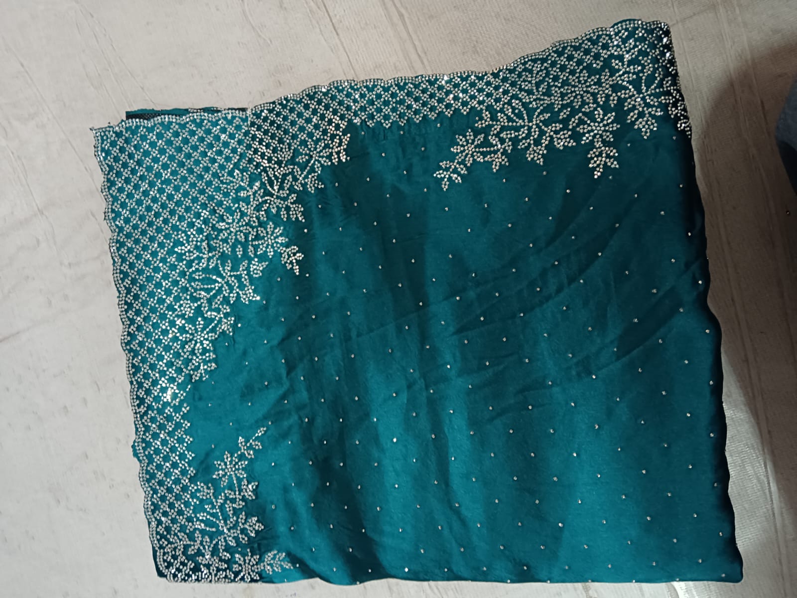 Premium Deep Teal Silk Saree with Intricate Gold Zari Embroidery and Heavy Zarkan Diamond Work.