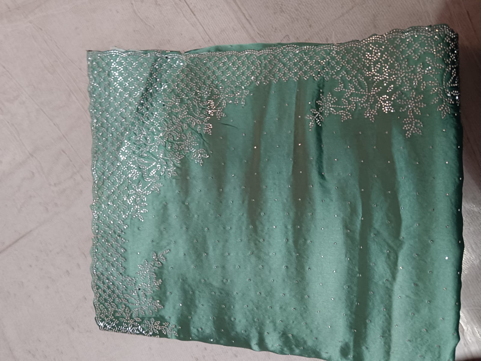 Premium Deep Teal Silk Saree with Intricate Gold Zari Embroidery and Heavy Zarkan Diamond Work.
