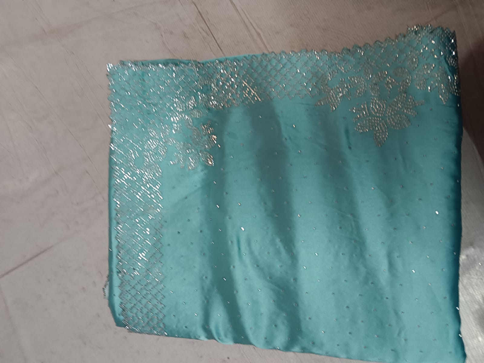 Premium Deep Teal Silk Saree with Intricate Gold Zari Embroidery and Heavy Zarkan Diamond Work.