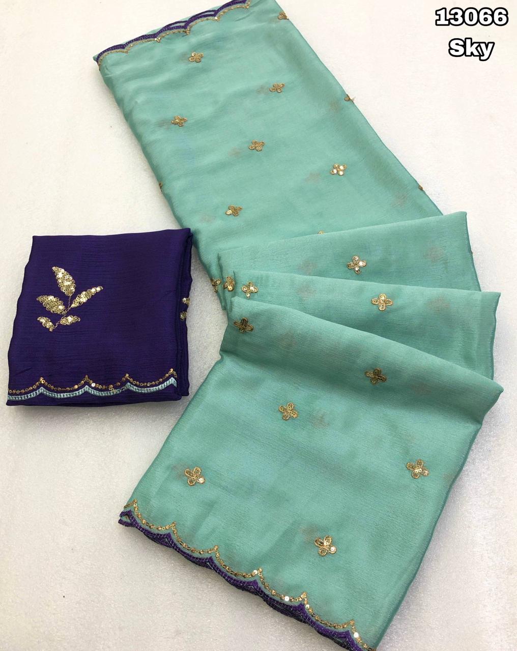 Teal fabric with gold embroidery and a matching purple