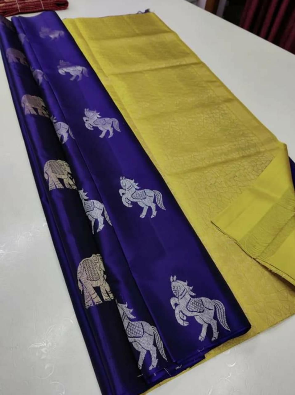 The silver zari (thread work) motifs of horses and elephantssilk saree