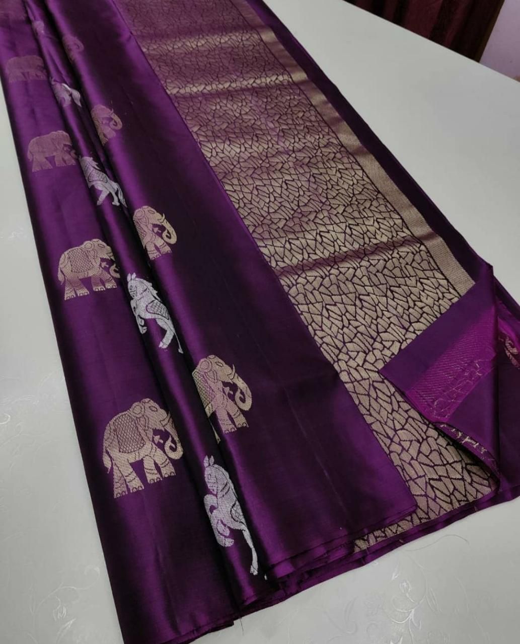 The silver zari (thread work) motifs of horses and elephantssilk saree