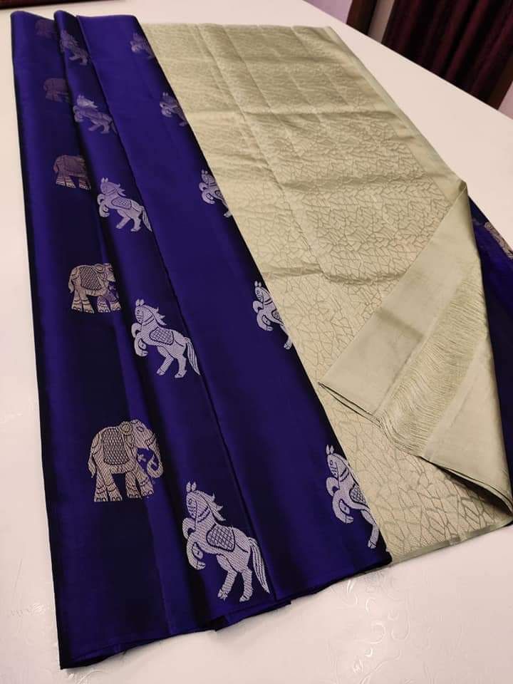The silver zari (thread work) motifs of horses and elephantssilk saree