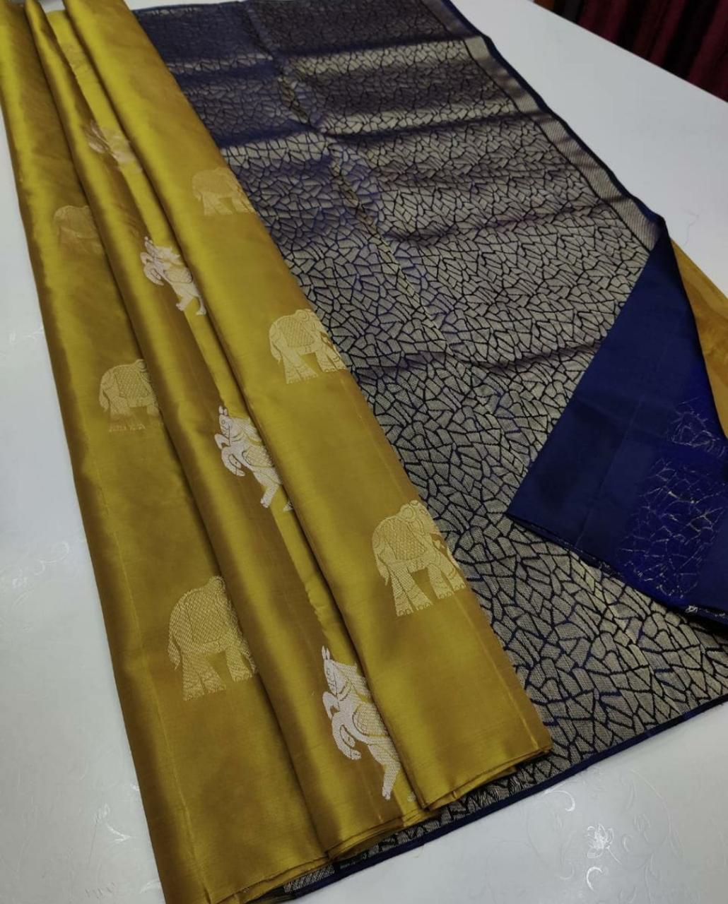The silver zari (thread work) motifs of horses and elephantssilk saree